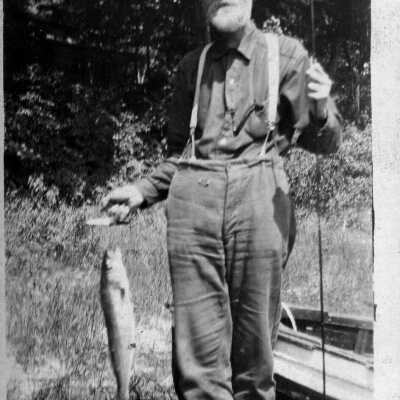 Digital file at 2021.72.02: 89-1-193_A_Ed_Rastall_with_fish.jpg