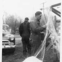          Bert Rastall hanging nets on a drying reel
   