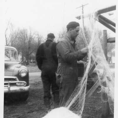Bert Rastall hanging nets on a drying reel