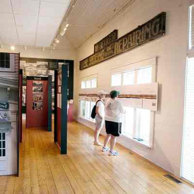 two visitors viewing the panorama mural in the exhibit 2006