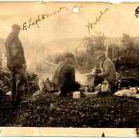 Lightheart and Welch cooking over a fire