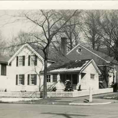 BB-SaugatuckLibrary-WomansClub.jpg 125KB: Woman's Club Buildings-Once the Public Library

On Nov. 25, 1904 a group of ladies met in the home of Hattie Bird to form a reading group. May Francis Heath was member number 10 in the roster, and, at 31, one of the youngest of the founders. A club constitution was developed and voted upon on Dec. 9th, and in the same meeting May was elected the club's first librarian. On May 5, 1905 she was chosen club secretary.

Over the next 57 years, May would serve as vice president, president, corresponding secretary, and was an active contributor to the many and varied educational programs. A natural speaker, she came to be frequently selected as toastmistress for the Club banquet. Her knowledge of local history was always evident, as she gave a program in 1916 on "Saugatuck's Early History".

In 1934, May was one of the trustees of the estate of Minnie Breuckman, who left the Woman's Club her family home at 303 Butler Street "for Woman's Club and library purposes" and a $2000 bequest for construction of an auditorium. Local architect Thomas Talmadge designed the structure and May was active in the fundraising which enabled its construction.

Her last Woman's Club meeting was a "Big Card Party Benefit to Paint the Club Library"(the Breuckman home) given by the club "Building Board" on August 8, 1961. She reported in her diary that they had a small crowd "only 10 tables in play".