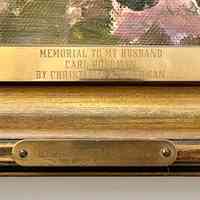          Two plaques on center front of frame; Memorial to my husband Carl Hoerman by Christiana A. Hoerman, Desert Spring Song.
   