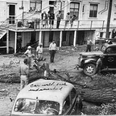89-1-114_Storm_Damage.jpg 973KB: Car with back end smashed, Bird, Mike, Peasley? 1944 Wires down