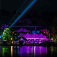          Glow in the Park tents as view from across Kalamazoo Lake; https://www.saugatuckhalloween.com/
   