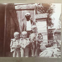         Two generations of fishermen at Fishtown shanty; Father Reuben Sewers (Sr.) with sons George and twins Rube and Frank
   