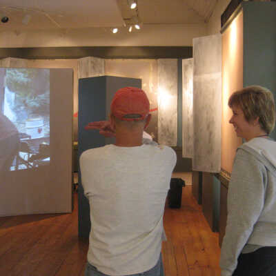 Bill Werme's Ox-Bow photos projected on to curved wall inside door
