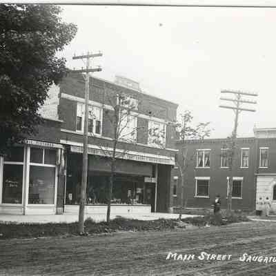 CWPC-0456ButlerStreet Parrish.JPG 276KB: Unpaved Butler Street with Parrish Drug Store on Mason Street.