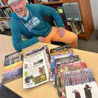          Bill McIlwaine, dressed for St. Patrick's day 2025 festivites, donating the collection.
   