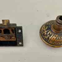          spring loaded latch mechanism and reverse side of doorknob
   