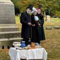          Ralph Hamilton, Julie Abel and Jacqueline Carey as William, Eliza and Emily Butler beside props assembled to evoke the Butler trading post.; Event photo by Kathy Fries-Wilson
   