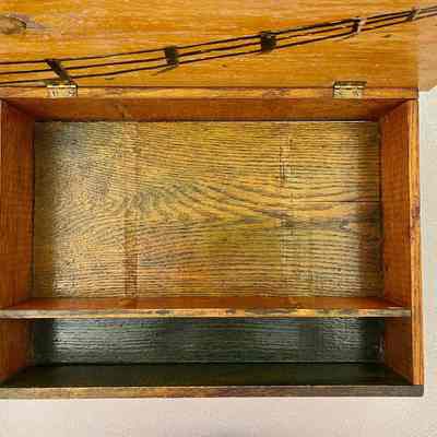 At one time, the box may have had two additional dividers in the larger compartment.