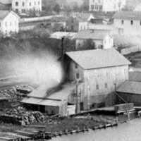          Site of the Rogers and Bird boat building yard. The large structure is the Heath grist mill as it looked in 1874. Some of the buildings are still here - the Tuscan Pot shop across the street, and Pumpernickels in the upper left corner.; Rogers & Bird property
   