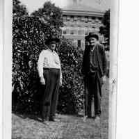          89-1-15 B. Barker.jpg 331KB; Two mature men standing outside a building
   