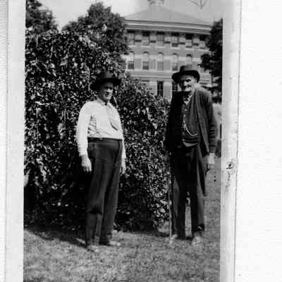 89-1-15 B. Barker.jpg 331KB: Two mature men standing outside a building