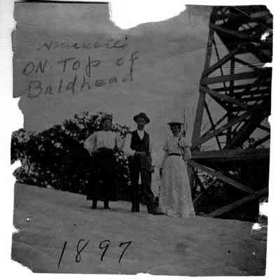 89-1-11_b_Annabelle_on_Baldhead.jpg 248KB: Two women and a man pose by the Mount Baldhead observation tower. Image is inscribed On top of Baldhead 1897tour
