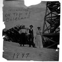          89-1-11_b_Annabelle_on_Baldhead.jpg 248KB; Two women and a man pose by the Mount Baldhead observation tower. Image is inscribed On top of Baldhead 1897tour
   