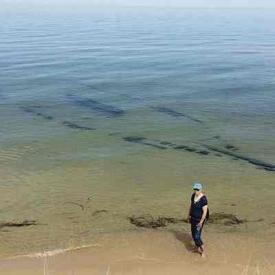 https://www.shorelinemedia.net/ludington_daily_news/news/local/article_0ee0cc68-360a-11e5-9204-2f923906af9f.html?mode=image&photo=0: Chris Newsome courtesy photo
Shipwreck found in Lake Michigan off the Nordhouse Dunes
Jul 30, 2015 Updated Jul 30, 2015 
Update:

After seeing a photo of a sunken shipwreck in shallow Lake Michigan water off the shoreline at Nordhouse Dunes, Michigan Department of Natural Resources Maritime Archeologist Wayne Lusardi said it may be the remains of the schooner George F. Foster, which was wrecked in October 1872.

“Although the identity of the wreck is inconclusive, it may prove to be the schooner George F. Foster, built at Newark (now Saugatuck), Michigan in 1852 by Jacob Randall,” Lusardi continued. “Foster was 93.6 feet long, 21.5 feet abeam, and measured 123 tons. Bound from Grand Haven to Chicago with a load of lumber, the schooner was blown off course by an autumn gale and wrecked in October 1872. The Foster’s class, dimensions, and location correspond favorably with the archaeological remains located near Ludington, though further research is required to make a positive identification.”

He said he visited the site about 10 years ago, when the wreck was partially buried by sand.

Shipwreck found in Lake Michigan off the Nordhouse Dunes

GRANT TWP. — The full outline of a roughly 60-foot-long shipwreck is now showing under a few inches of Lake Michigan water off the shore of the Nordhouse Wilderness Area north of Ludington.

Chris Newhouse of Ann Arbor and his wife, Cathey, found the wreck while hiking about a week ago in the Nordhouse Dunes, about three and a half miles south of the U.S. Forest Service Lake Michigan Recreation Area.

Chris reported it is also about a mile south of the Nurnburg Road parking area.

Wayne Lusardi, maritime archeologist for the Michigan Department of Natural Resources, isn’t sure what boat it is at this time. He said there are probably about 40 shipwrecks off shore near Ludington, including the Lizzie Doak, an 75-foot boat that sunk near the shore on Aug. 30, 1892.

“This year there’s a lot of sand that’s been moving around and a lot of near-shore wrecks are considerably more exposed than they have been in the past,” Lusardi said.

Kenneth Morris, a petty officer 1st class at Manistee’s U.S. Coast Guard station, said the wreck is not on Coast Guard charts.

Read the full story in Wednesday's Ludington Daily News print and eEditions.