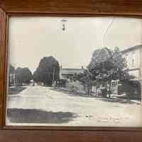          Photo as it arrived in a frame.; Photo was removed from frame in July 2024 as per conservation best practice.
   