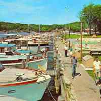          Boat.Postcard.jpg 1.5MB; Digital file on Jack Sheridan Drive 2021.72.02 pleasure boats docked at boardwalk behind the Butler. According to Jack Sheridan, this circa 1963 postcards shows dock attendant Ron Chase walking in the foreground.
   