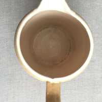          Craquelure pattern in glaze at bottom of jug.
   