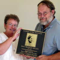          Peg Sanford and Chris Yoder with the plaque
   