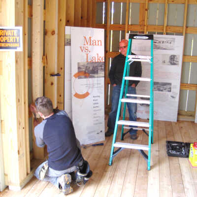 Aigo boat barn graphics installer overseen by Jim Schmiechen