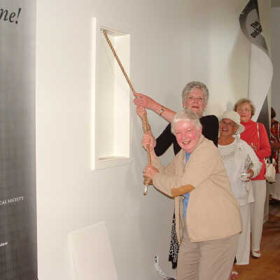 Nancy Budd and Dottie Lyon ringing the bell: Lady in white hat unknown, Cynthia Sorensen (in red) and Maryrita Peters (in yellow)