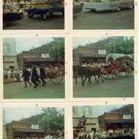          94-1-13A_Saug._Centennial_parade.jpg 1.4MB; Johnny Appleseed, Fire Department Hose Reel, covered wagon, crowds outside the Embassy
   