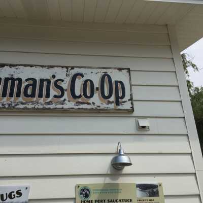 Dan Cook's tiny signature is under to second "O" in Co-Op.