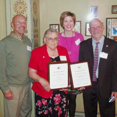 Vic Bella, unknown lady in red, Sally Winthers and Jim Schmiechen collect Michigan Historical Society award