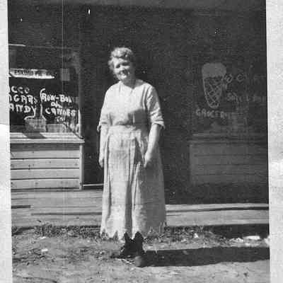 MayFerryStore.jpg 378KB: May Francis Heath standing in front of the Heath Shop