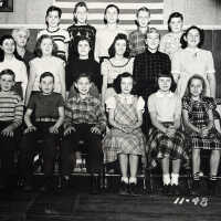          1948; BACK ROW - Kim Green, Johnny Mueller, Ralph Troutman, Jimmy Bruce, Earl Herring. MIDDLE - Patsy Engel Hopper, Jane, Jean and Joan Norman, Maggie Van Syckel, Kay Schreckengust Spenser FRONT - Harry Forrester, Mike McVoy, Glenn Goddin, Florence Goodin [unknown], Helen Mueller
   