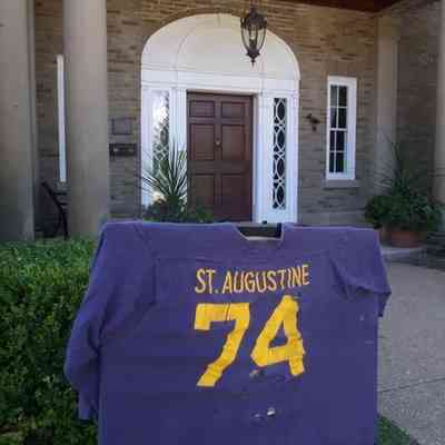 © The Holland Sentinel June 26, 2013: A sports jersey from St. Augustine Seminary High School lets reunion participants know they're in the right spot at the Felt Mansion on Saturday, Aug. 11. Jim Hayden/Sentinel staff
