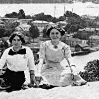          Girls get photographed atop Mt. Baldhead.
   