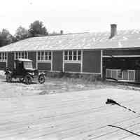          New Edgewater livery at the southwest corner of Main and Water Streets before Main Street was paved circa 1922; Photo processed and described by James T. Faasen.
   