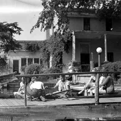 Deam31.jpg 399KB: Passenger in rowboat at chain ferry crossing