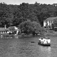          Deam32.jpg 341KB; Passengers being rowed across Kalamazoo River with Ferry Store and Beachway in distance.
   