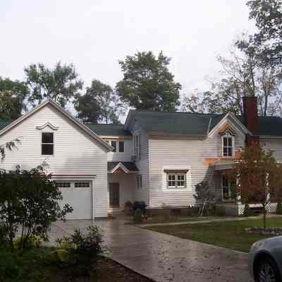 the house circa 2020s with garage addition
