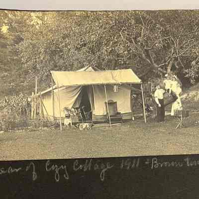 Rear of Cozy Cottage 1911 Brown Twins Hazel and Helen: Glamping in tent set up behind family home