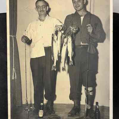 Tucked inside: A much later photo of Charles J. Frehse's brother Russell R. Frehse and his son Charles R. "Buddy" Frehse: with their fishing kit and catch and their trouser legs rolled up