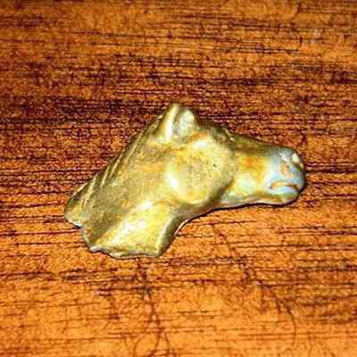 Horse head token from Godfather Monopoly game: Monopoly-The Godfather tokens, houses and hotels from the 2012 version as listed for sale on eBay, July 2024