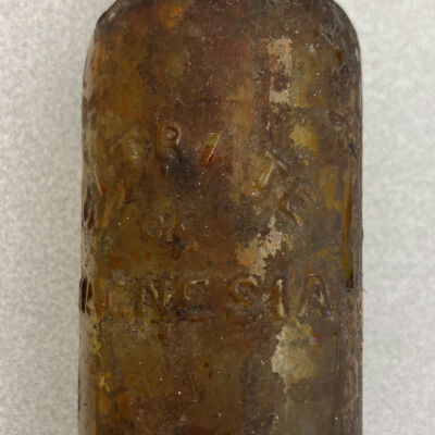 12. Brown glass bottle marked "Citrate of Magnesia"