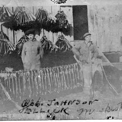 89-1-153_Muskrat_Trappers.jpg 451KB: Two men and three shotguns are posed with many muskrat pelts that are stretched for drying. Geo Johns or ELLICK Muskrats