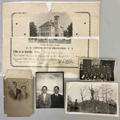 8th grade diploma from Saugatuck Public Schools, brothers Russell and Charles in vignette, Charles and an unknown boy (on right) sitting at a portrait studio, "Chow Time" photo from France has "Can you find me?" written on the back, and his mother at the St. Joseph, Michigan Soldiers monument in 1939