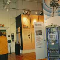          at right, finned radar tower with radar cabinet on display and sputnik model
   