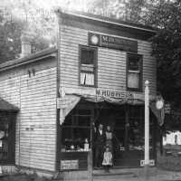          Photo caption - Robinson family, front of shop ca 1902; filename: Robinson shop Butler st ca 1890
   