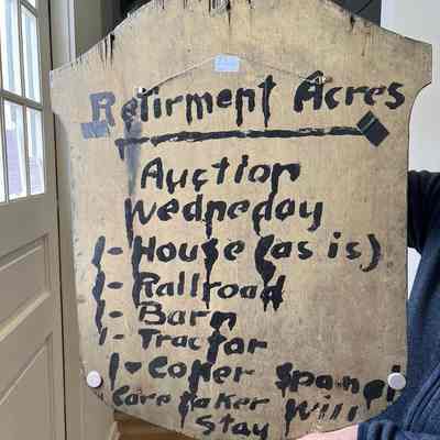 sign back: it appears the back of the sign was repurposed to promote an auction