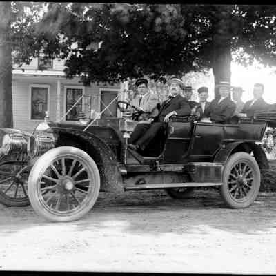 Sim Old car B.jpg 567KB: Open car loaded with well dressed gents. Location could be Culver Street.