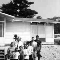          Beaver-family_group.jpg 241KB; Erik Peterson donation/Digital file on Jack Sheridan Drive 2021.72.02
Family posing in the front yard of a residence, possibly on Beaver Island
   